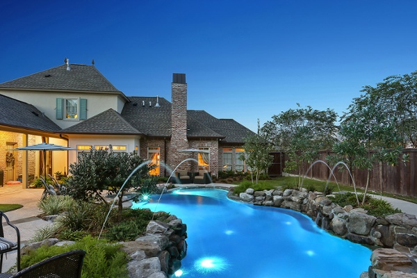 Water features natural rock at night pool