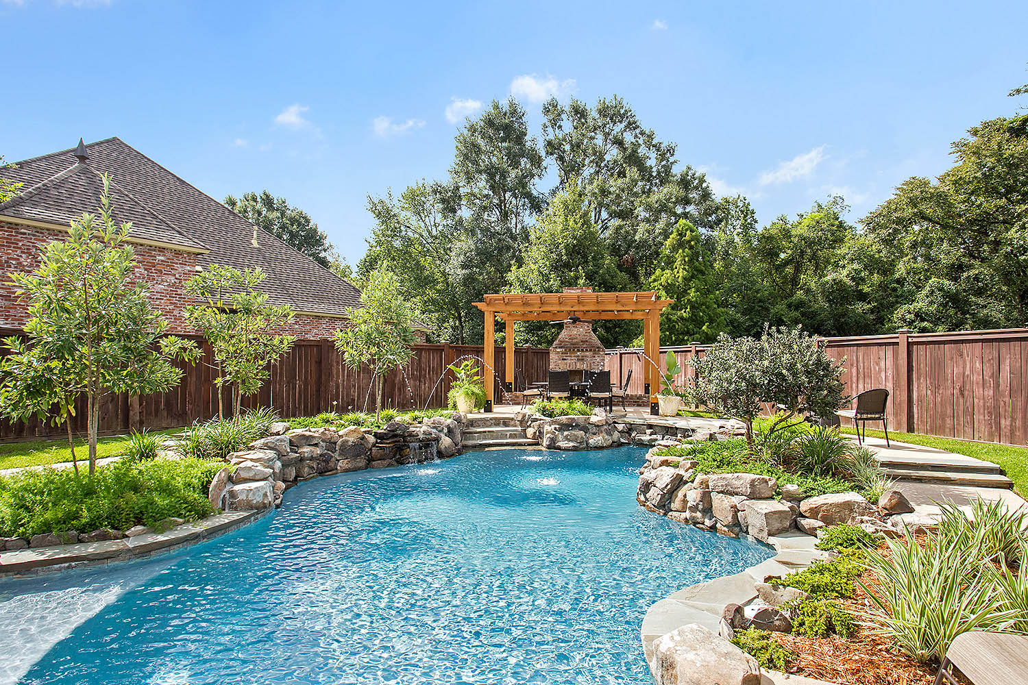 Pool with natural rocks and waterline features